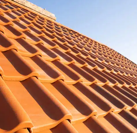 Overlapping,Rows,Of,Yellow,Ceramic,Roofing,Tiles,Covering,Residential,Building